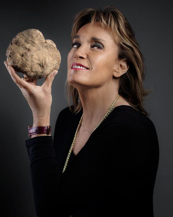 Portrait of Olga Urbani holding a white truffle