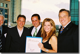 (L to R)  Michael DiPasquale, sports anchor at WSVN Fox 7; Mayor of Miami, Manny Diaz; Michele Gillen, chief investigative reporter at WFOR; and Arthur J. Furia, Esq., NIAF regional vice president for the southeast region at the National Italian American Foundation’s NIAF) media networking dinner at the pool deck of the Conrad Miami hotel .  